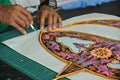 Malaysian kite maker working on a kite in his workshop Royalty Free Stock Photo